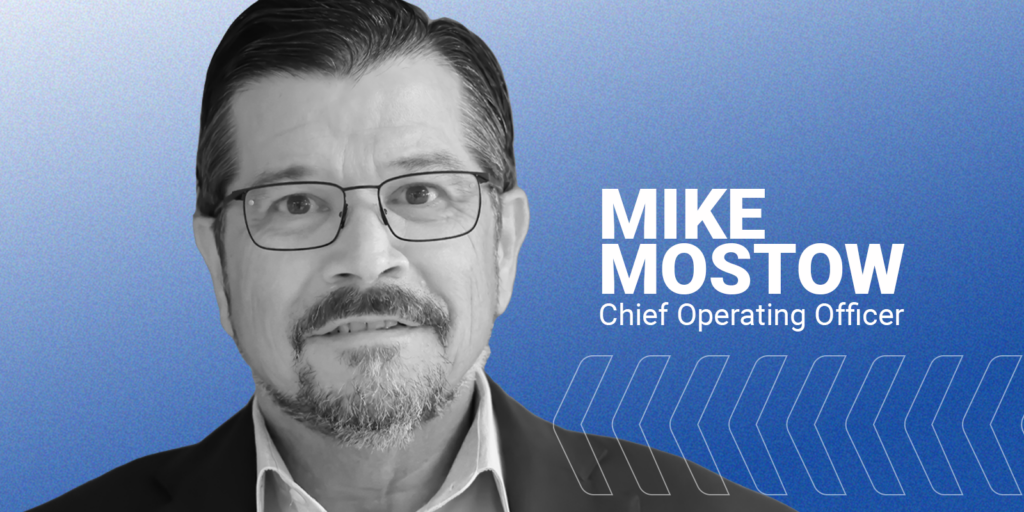 B&W image of Mike Mostow with his name and title on a blue background